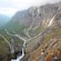 Curving roads and streams intersect like veins on the side of a mountain